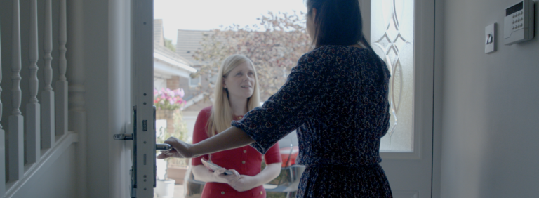 Claire Hazelgrove MP knocking on doors and listening to a local resident